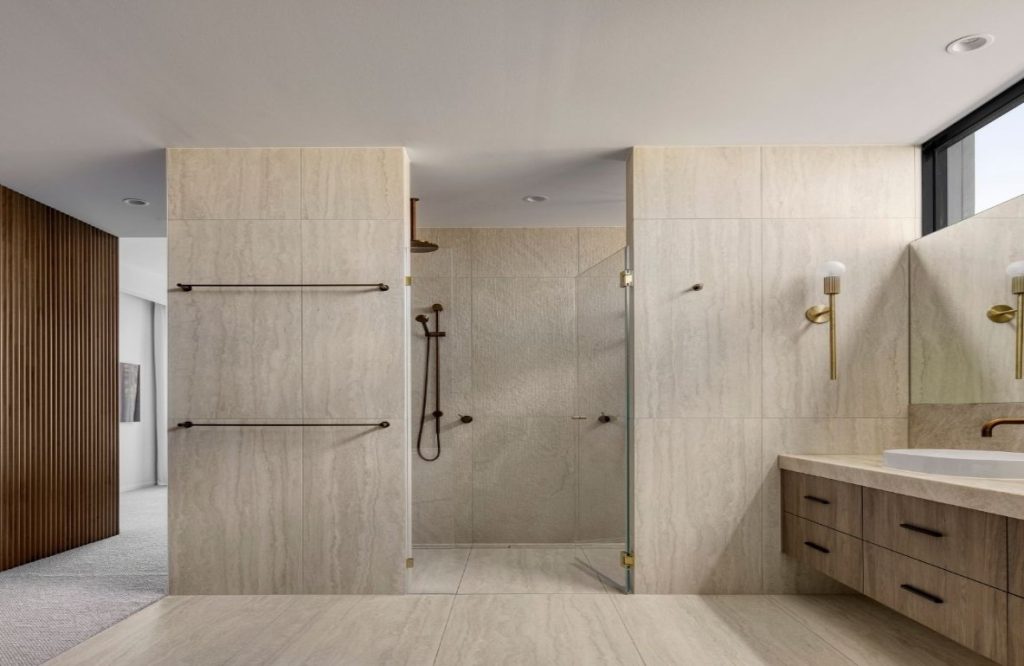 High-end bathroom with stunning design tiles using a vein cut cream travertine. modern lifestyle. travertine tiles Moorabbin. Atlas Tile & Stone.