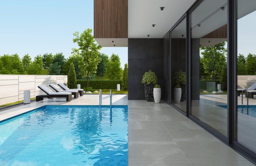 Elegant pool surround with tumbled cross cut travertine paving. Atlas Tile & Stone , Supplier of travertine outdoor tiles in Moorabbin.