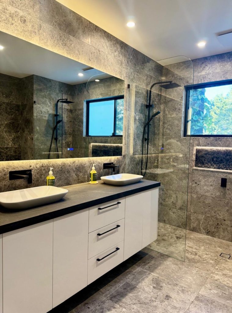 Aussi luxury bathroom designed by natural black marble Ritai. By Tiles supplier in Moorabbin, Atlas Tile & Stone