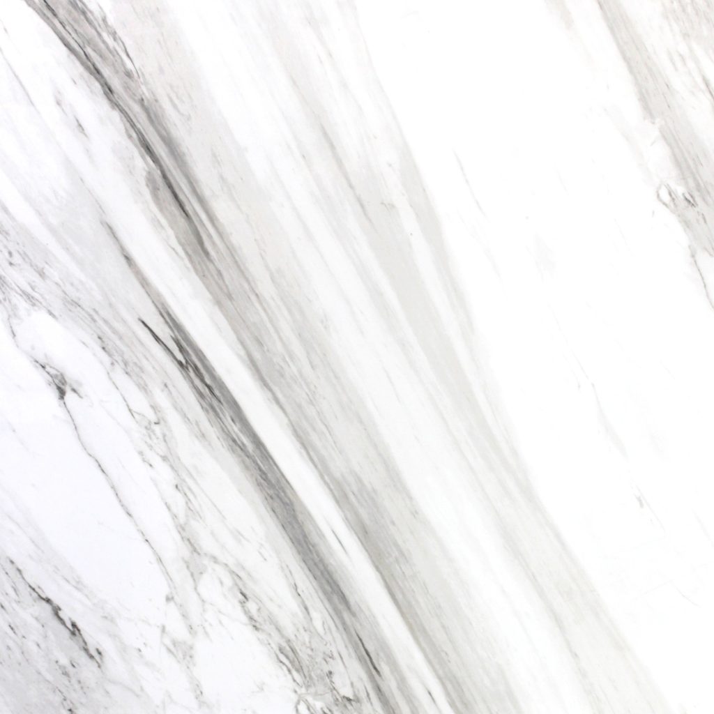 Volakas white marble look porcelain tiles. 1200x800x12mm in polished finish. Atlas Tile & Stone natural stone supplier with services at Moorabbin, Cheltenham, Brighton, Sandringham, Hampton, Black rock, Highett, Beaumaris, Parkdale, Mordialloc, Dingley Village, Mentone, Clayton